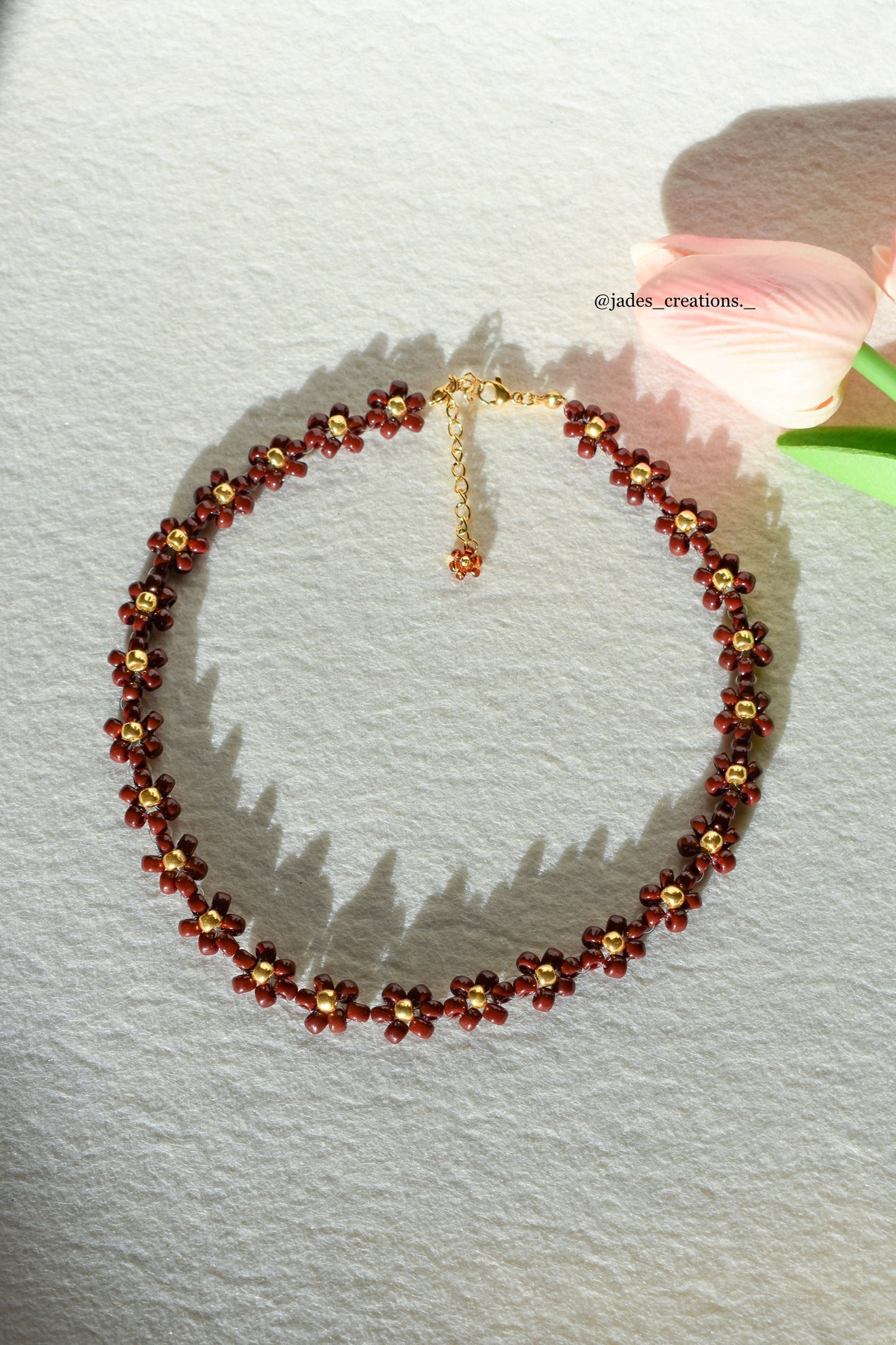 Collana floreale color cioccolato oro